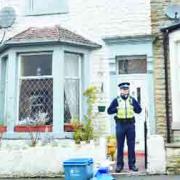 POLICE PRESENCE: An officer outside the property in Willow Street raided by police