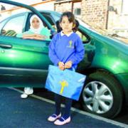 COSTLY NIGHTMARE: Noorjahan Karbhari said she has had to buy a car to take her daughter, Fatimah, to St Francis' School, Cherry Tree, while the family live minutes walk from Wensley Fold School