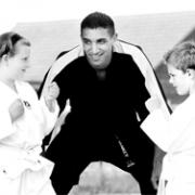 Karate KIDS: Martin Yankey with Hannah Jenkins and Lloyd Foster, pupils at The Redeemer School, Blackburn