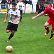 Action from Bacup Borough's (white) defeat to Longridge Town at the weekend