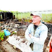 DEVASTATED: Gordon Green surveys the burned out remains of his shed and greenhouse on his plot at Queen’s Park Allotments in Blackburn    Picture: COLIN HORNE