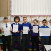 Lancashire Telegraph reporter Neil Athey with Belthorn Academy Primary School pupils who wrote their first school newsletter 'The Belthorn Bulletin' this term