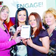 MESSAGE: Brook worker Vicky Quirk, left, and Brook chief executive Julie Wareing with Jemma Laing and Kayleigh Bell, stars of the But I thought he loved me' DVD, which was shown at the conference