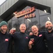 Thwaites brewing team toast their success with pints of 13 Guns beer