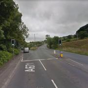 A motorcyclist has collided with a car in a crash at the junction of Bacup Road and Burnley Road