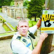CRIME SCENE: PC Paul Schofield puts up a warning sign at Corporation Park