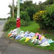 Floral tributes have been left at the scene