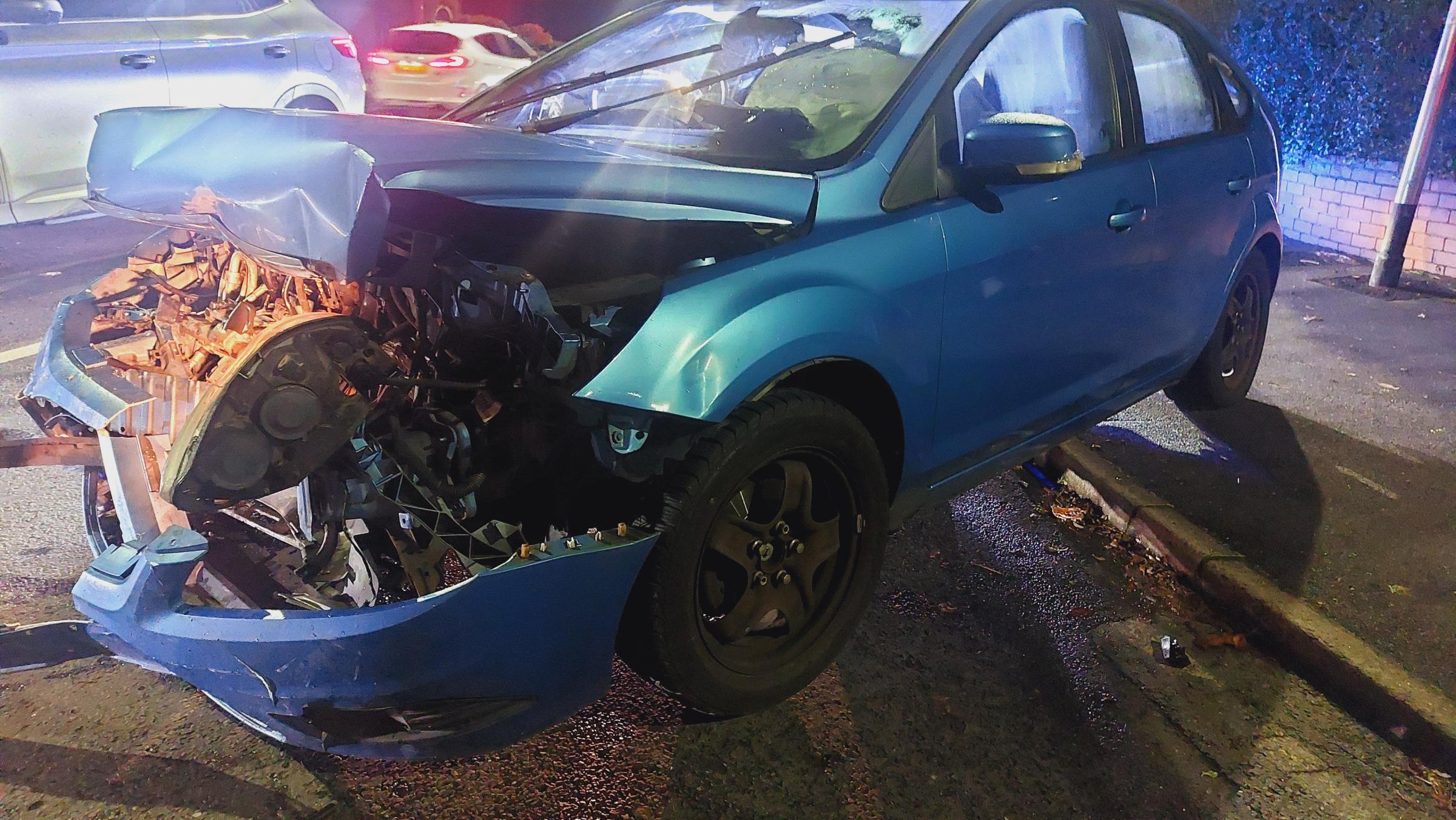 Wreckage strewn across the road after crash on busy Blackburn road