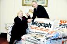 John Anson of the Lancashire Telegraph presents a cheque to Vicky Shepherd of Age UK Blackburn with Darwen