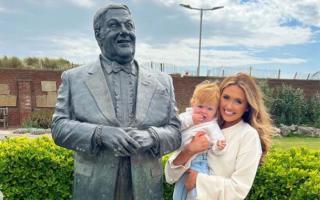 Charlotte Dawson with son, Noah Sarsfield, at the Les Dawson statue in Lytham St Annes