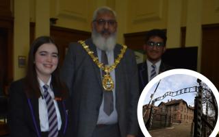 Holocaust Memorial Day: Witton Park pupils with Blackburn mayor Suleman Khonat . Inset is the gate of the Auschwitz Nazi death camp