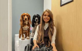 Chloé Fuller with her support dogs, Cinna and Ted