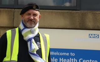Falklands Veteran Steve Butterworth with a specially made scarf in Falkland Island colours.