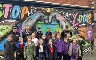Competition winners with ward councillors, representatives from the police and local graffiti artist KingSyze Graffiti