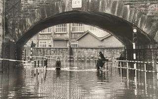 Stubbins Bridge has always been a notorious spot for flooding. Here the water is up to the handlebars of young cyclists pedalling through in September 1968