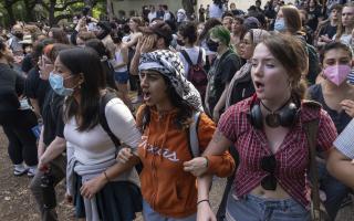 Demonstrators chant at a pro-Palestinian protest at the University of Texas . Protests on campuses have galvanised a whole generation of students.
