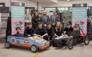 Students from Nelson and Colne College have cast their expert eyes over one of the vehicles due to compete in this year's Super Soap Box Challenge.