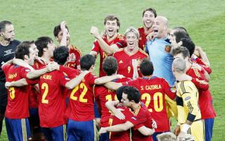 Spanish players celebrate their win.