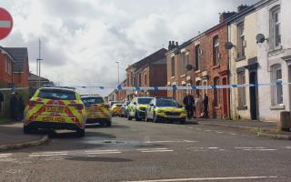 Police in Stansfield Street, Blackburn