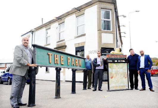 Naseer Yaseen of Jay’s Properties, Usman Ghani, Yasran Yaseen, Councillor Dave Smith, restaurant owner Harry Iqbal proudly display the old pub signs at the Armaan
