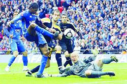 CUP BLUNDER: Cardiff goalkeeper Peter Enckelman  who was on loan from Blackburn  spilled the cross that led to Kanu scoring Portsmouth's FA Cup final winner on Saturday. Enckelman is among those released by Rovers.