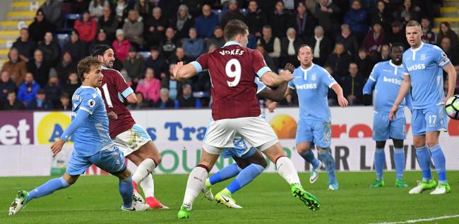 BIG GOAL: George Boyd sweeps home the winner for the Clarets against Stoke City on Tuesday which moved them further away from danger