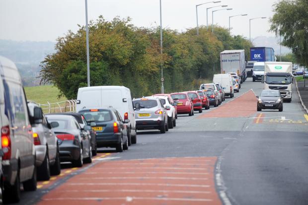 Delays on busy A road caused by road closure after smoke spotted from vehicle