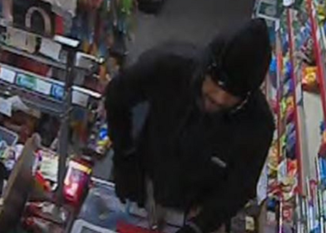 Robber pulls gun on teenage shop worker