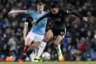Burnley's Dwight McNeil under pressure from Manchester City's Kevin De Bruyne